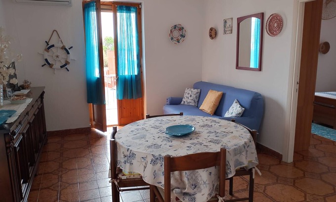 Lu Bagnu House | Holiday Home 'Al Mare' with Private Garden, Balcony and Air Conditioning