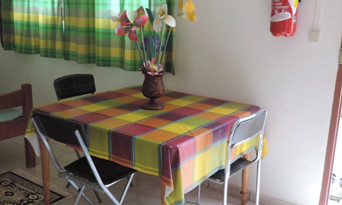 Le Robert Apartment | Homerez - Apt. Central in Le Robert, Garden View.