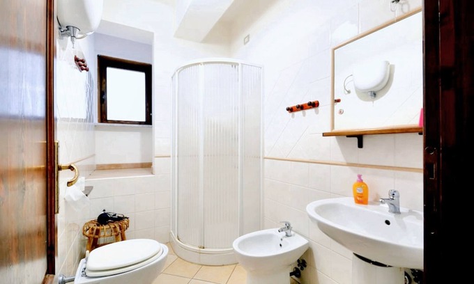 Parghelia Apartment | Homerez - Bright House in Vibo Valentia, Shared Pool