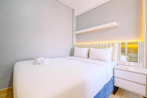 Depok Apartment | Homey and Modern Look 2BR Transpark Cibubur Apartment By Travelio