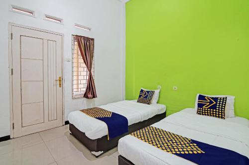 Pekanbaru Hotel | Hotel O Penginapan Puti SyariahNearBandara Sultan Syarif Kasim II
