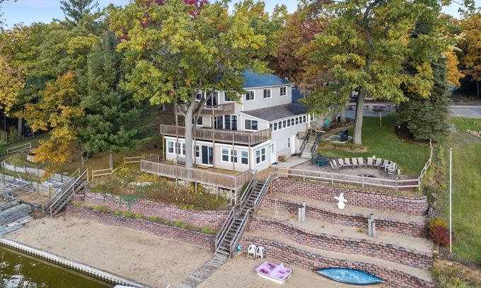 Newaygo House | Huge lake house. 3 levels. 9 bedrooms. Great for groups. Large beach. Fire pit.