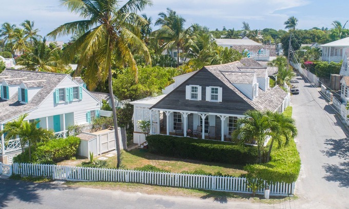 Dunmore Town House | Iconic Waterfront Cottage with Sunset Porch