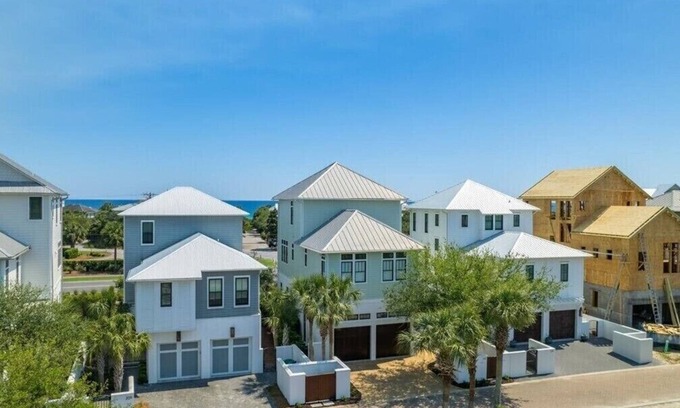 SeaNest Village House | includes golf cart! SeaNest stunner with Gulf views, 4 adult bikes. EV charger