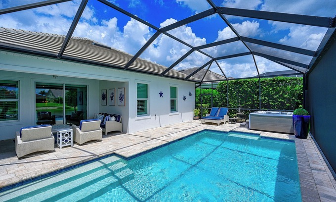 Rural Estates House | Indulge in a lavish home, heated saltwater pool, & spa, near all Naples offers.