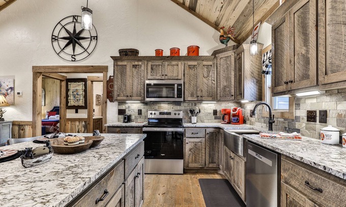 Ellijay Cabin | Indulge in romance at French Kisses! This new, pet-friendly cabin offers a hot tub, fire table, and WiFi for an unforgettable getaway