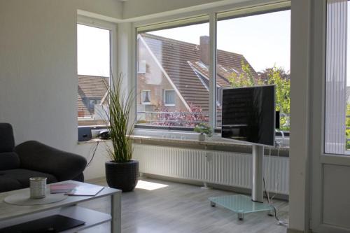Neue Tiefe House | Inselblume 58 - Ferienwohnung mit Balkon in Neue Tiefe