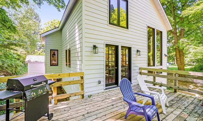 Benzonia House | Inviting home in great location with large deck, firepit, gas grill & streaming