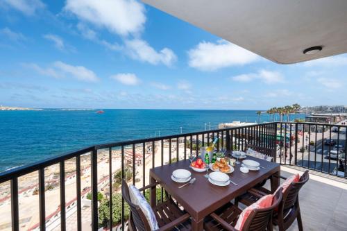 Bugibba Apartment | Islet Promenade Seafront Apartment with large Corner Terrace by Getawaysmalta