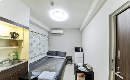 Shinsekai Apartment | JOJOのTC House通天閣新世界1分 関西空港難波大阪城直行 日本橋黒門徒歩圏内 USJ1回乗換