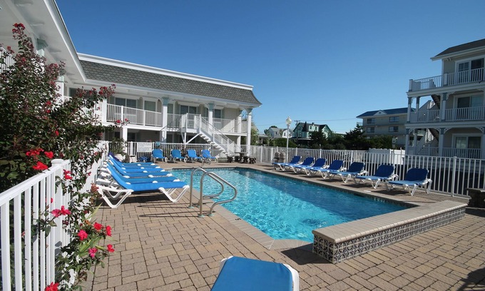 Cape May Condo | JUST ACROSS THE STREET FROM THE BEACH! PARK YOUR CAR & WALK! Granite countertops and stainless appliances. In ground pool at property.