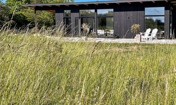Sodvik House | Just one kilometer from the water, this modern and cozy cottage with a view of the Swedish nature aw