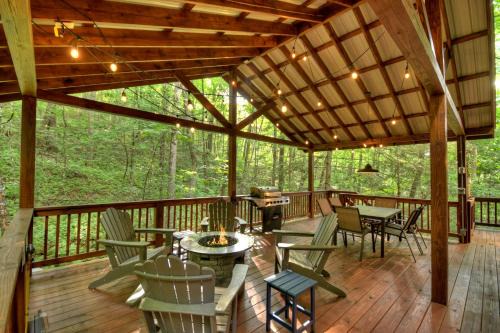 Cashes Valley Villa | K6 Lodge Gather around the firepit soak in the hot tub and splash in the creek
