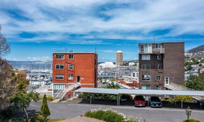 Hobart Central Business District Apartment | King Bed, Water Views, Private Parking, Courtyard Living in the Heart of Sandy Bay