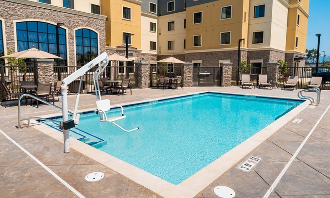 Newark Condo | King Suite. Free Breakfast. Pool. Shared BBQ. Your Next Trip!