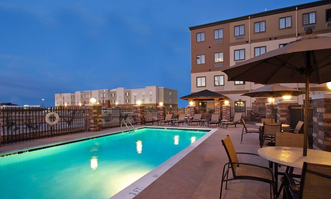 Odessa Condo | King Suite. Free Breakfast. Outdoor Pool. Gym. Near the University of Texas Permian Basin!