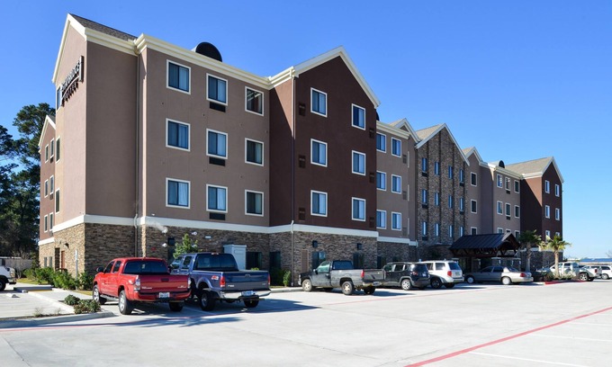 Tomball Condo | King Suite in Tomball | Shared Outdoor Pool + 24h Fitness Center
