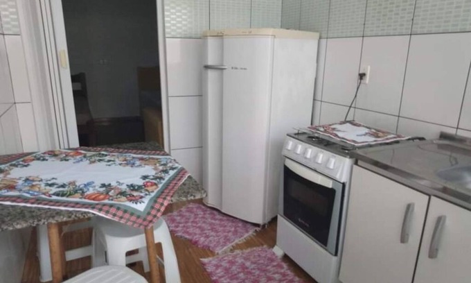 Barra Velha Apartment | Kitchenette near the beach with air conditioning.