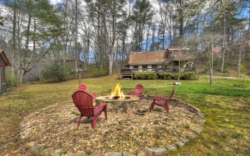 Morganton Villa | Knotty Creek Retreat Creek access firepit hot tub wood-burning fireplace