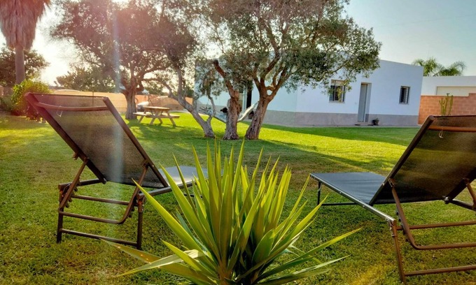Conil de la Frontera Ski Chalet | La Caleta House. Beautiful garden with olive trees, drive minutes from the beach.