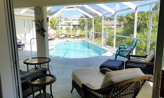 Pebble Beach House | La dolce vita awaits in this immaculate pool home on fresh water canal.