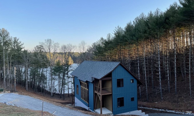 Nebo House | Lake front home with dock in a small cove with a beach.