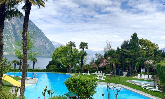 Bissone Apartment | Lake view apartment with terrace, outdoor pool and parking space