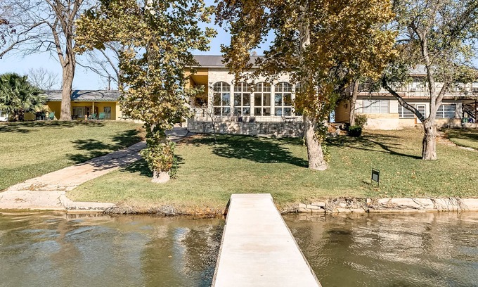 Kingsland House | Lakefront home with patio, grill, lake views, office, lake access & washer/dryer