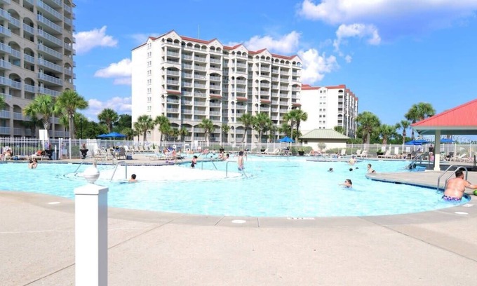 North Myrtle Beach Condo | Lakefront Luxury 15000sf Pool in Amazing Location