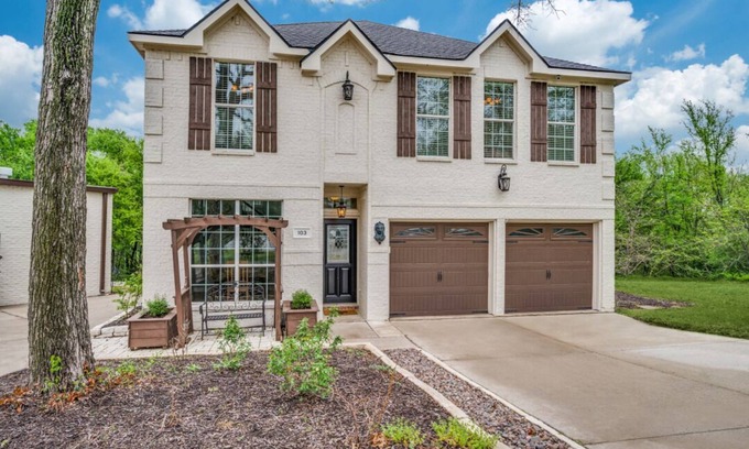 Little Elm House | Lakefront retreat just steps from Lake Lewisville! Enjoy 341 ft of shoreline, a private cove, sandy beach, fire pit, and pergola with built-in grill. Inside: lake views, travertine floors, cozy fireplace, and an upstairs game room with balcony.