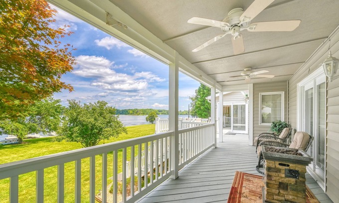 Sandy Point House | Lakefront retreat with a large yard, stone fire pit, gazebo, deck, & dock