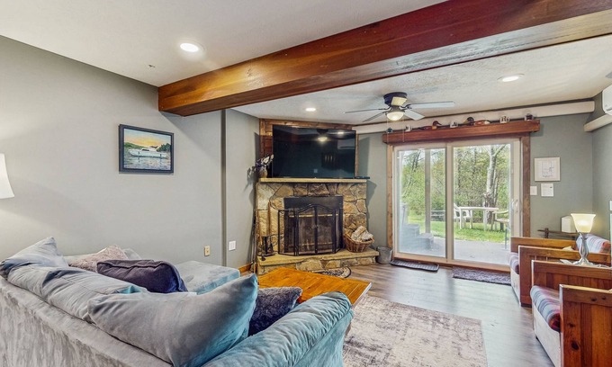 McHenry House | Lakefront townhouse near lake & skiing with hot tub & wood-burning fireplace