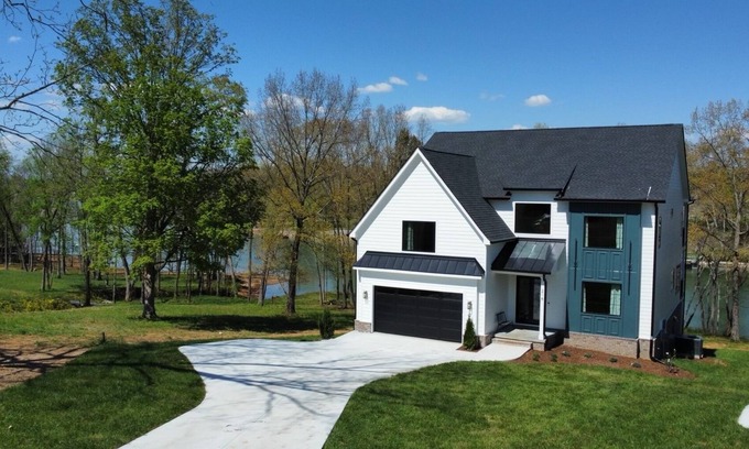 Winchester House | Lakeshore Modern! Lake front with platform dock and 2 kayaks, firepit and views