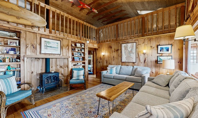 Malletts Bay House | Lakeside cottage w/mountain views, canoes, firepit, enclosed porch, bbq, beach