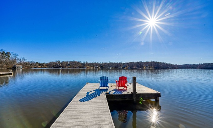 Orange House | Lakeside retreat with a firepit, dock, sprawling deck, pool table - dog friendly