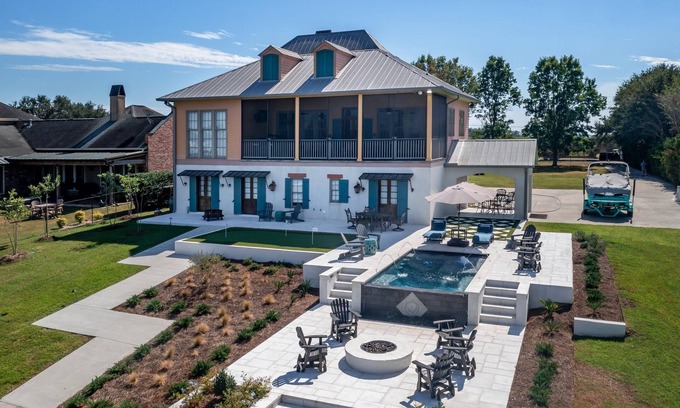 Livonia House | Large Beautiful Home On False River w/Pickleball Court and Heated Cocktail Pool