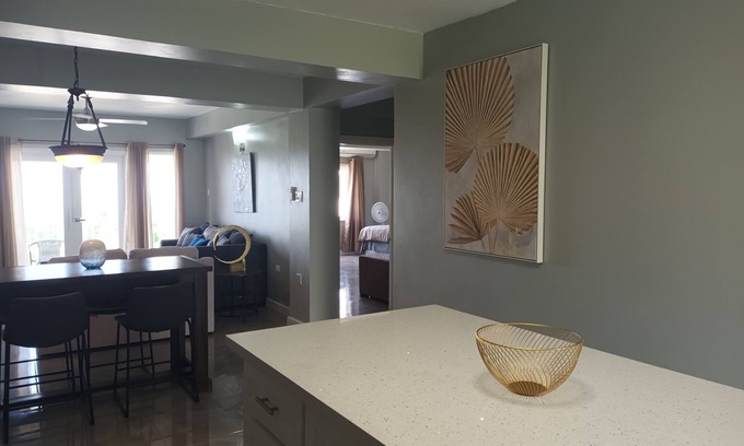 IronShore Estates Apartment | Large Family 2 bedroom 2 bathroom apartment in Ironshore. Kitchen. Pool, lounge