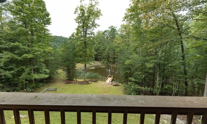 Zoe Cabin | Large Log home, private pond with dock, canoe, pool table, hot tub & internet.