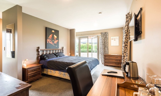 Rolleston House | Large master bedroom with en-suite and bath in our Private House
