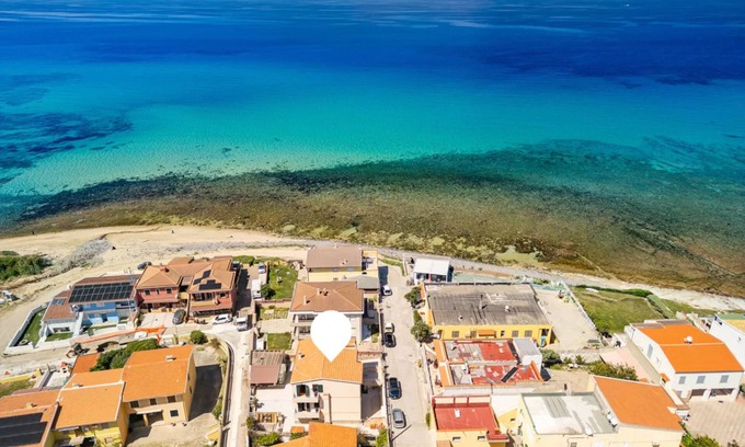 Lu Bagnu Apartment | Large seaside apartment with patio in Lu Bagnu