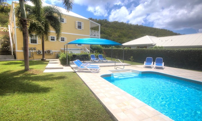 Jolly Harbour Apartment | Large Swimming Pool, Garden and Sea Views