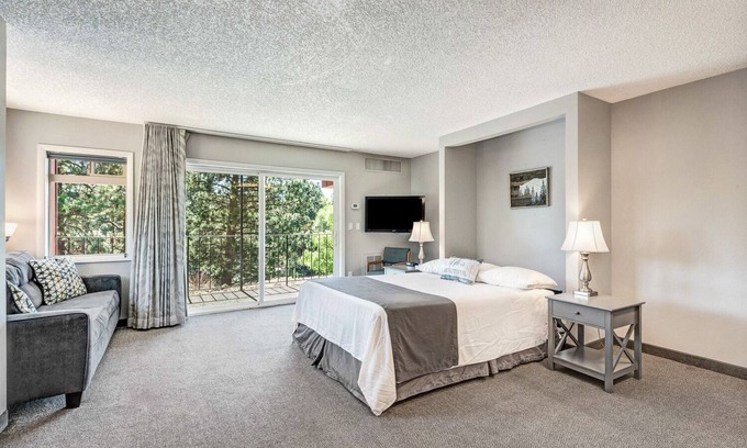 Orchard District Apartment | "License to Mill" Downtown Corner Studio with 270-degree Riverview