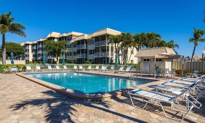 Marco Island Condo | Light and Bright Walk to the Beach Condo