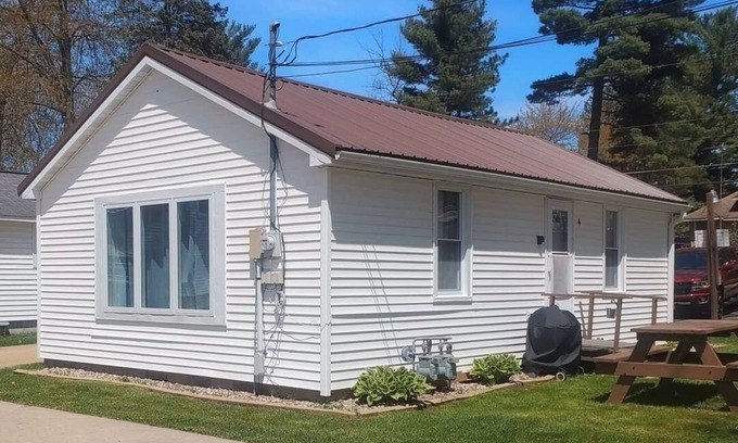 Shawano Cottage | Lilly Pad North, Cottage #4 is on Shawano Lake, nestled among 4 other cottages. Beautifully located. Relaxing days on the beach and sunsets by the firepit are the best.