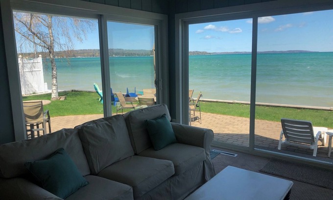 Traverse City House | Located directly on East Grand Traverse Bay with sandy beach