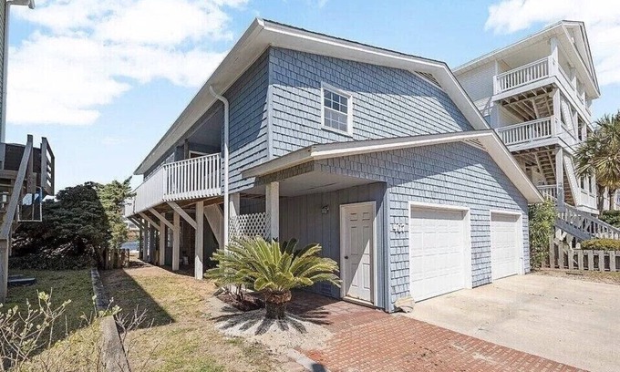 North Carolina Coast House | Located directly on canal w/beautiful water front views — one block from beach