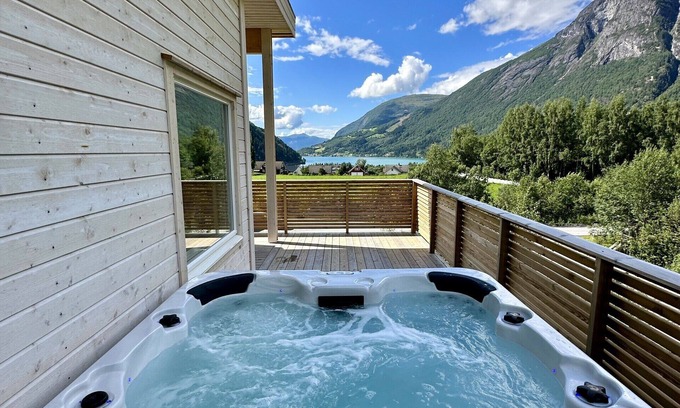 Loen Apartment | Loen Panorama in Stryn, outdoor hot tub with fjord and mountain views