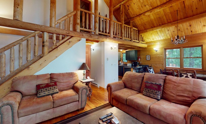 McHenry House | Log cabin in forested setting with private hot tub & amazing views, dog-friendly