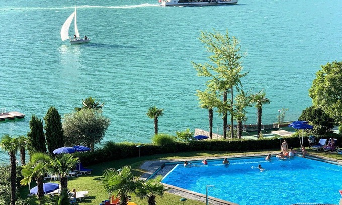 Bissone Apartment | Lovely apartment for 4 people with A/C, WIFI, pool, TV, balcony, panoramic view and parking