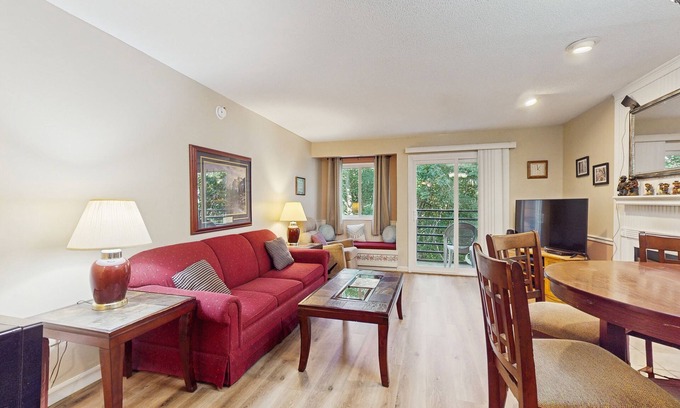 Chalet Village Condo | Lovely condo w/free attraction tickets, outdoor pool, fireplace & balcony